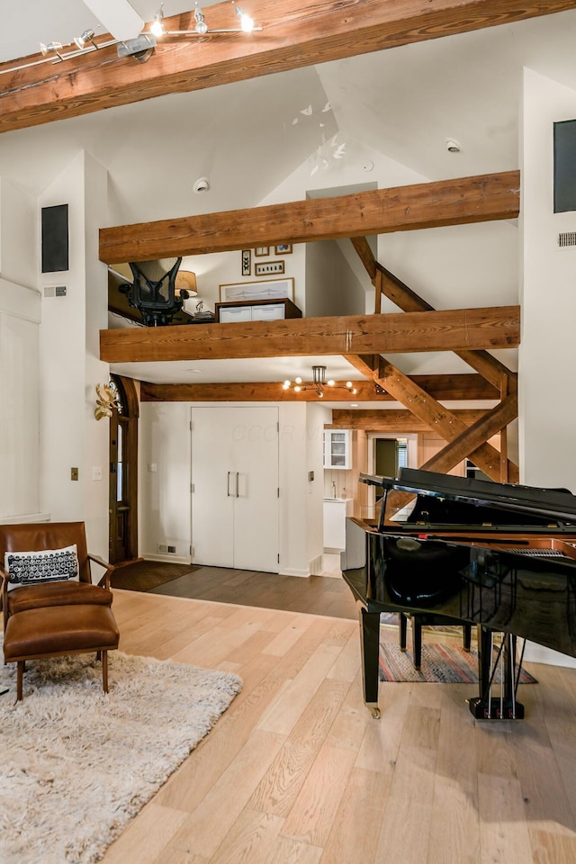 584 Franklin Ave, Columbus, OH 43215 - interior space featuring high vaulted ceiling, beamed ceiling, and light wood-style flooring