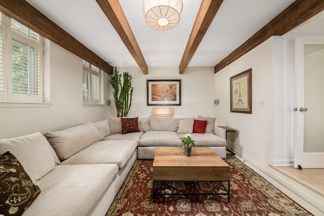 584 Franklin Ave, Columbus, OH 43215 - living room with beamed ceiling, baseboards, and wood finished floors