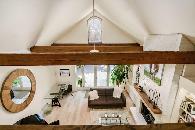 584 Franklin Ave, Columbus, OH 43215 - living area featuring healthy amount of natural light, wood finished floors, high vaulted ceiling, and french doors
