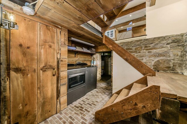 584 Franklin Ave, Columbus, OH 43215 - kitchen featuring washer and dryer, brick flooring, wooden ceiling, and lofted ceiling