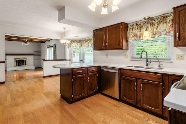 13582 Capetown Ave, Pickerington, OH 43147 - kitchen featuring dishwasher, a peninsula, light countertops, and light wood-style flooring
