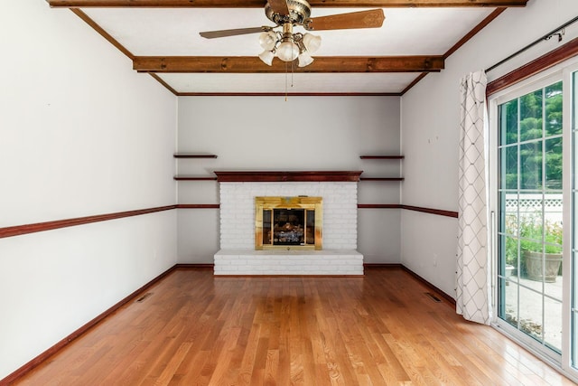 13582 Capetown Ave, Pickerington, OH 43147 - unfurnished living room featuring hardwood / wood-style flooring, ceiling fan, beamed ceiling, a fireplace, and ornamental molding