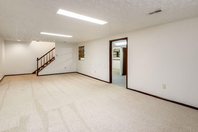 13582 Capetown Ave, Pickerington, OH 43147 - empty room featuring a textured ceiling, carpet, and stairs