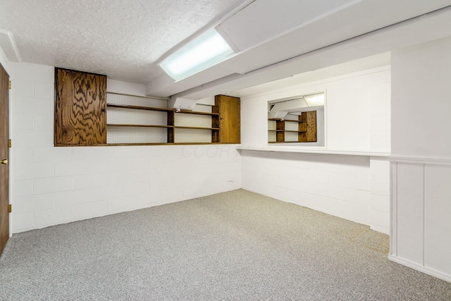 13582 Capetown Ave, Pickerington, OH 43147 - finished below grade area with carpet flooring, a textured ceiling, and concrete block wall