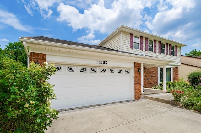 13582 Capetown Ave, Pickerington, OH 43147 - traditional home featuring brick siding, concrete driveway, and an attached garage