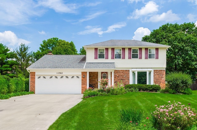 13582 Capetown Ave, Pickerington, OH 43147 - view of front of house featuring brick siding, an attached garage, a front yard, concrete driveway, and a shingled roof