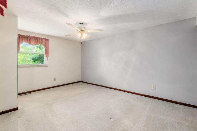 13582 Capetown Ave, Pickerington, OH 43147 - spare room featuring ceiling fan, carpet flooring, and a textured ceiling
