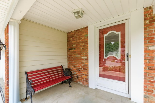 13582 Capetown Ave, Pickerington, OH 43147 - doorway to property with brick siding and covered porch
