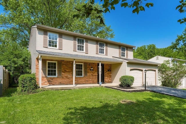 6541 Skywae Dr, Columbus, OH 43229 - traditional home featuring a porch, asphalt driveway, a garage, and brick siding