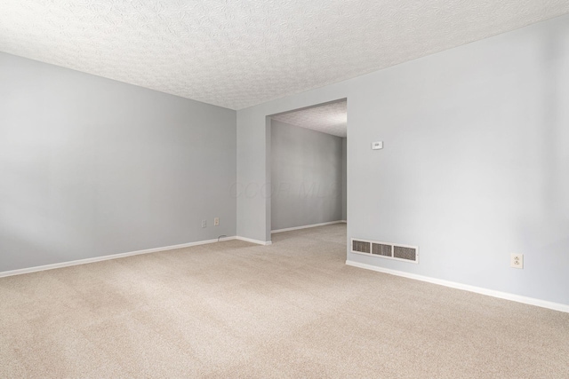 6541 Skywae Dr, Columbus, OH 43229 - empty room with light carpet, a textured ceiling, and baseboards