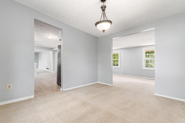 6541 Skywae Dr, Columbus, OH 43229 - unfurnished room featuring carpet flooring, a textured ceiling, and baseboards