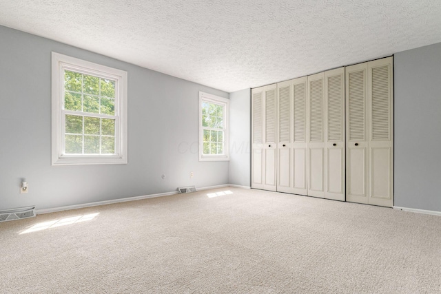 6541 Skywae Dr, Columbus, OH 43229 - unfurnished bedroom with carpet flooring, a textured ceiling, and baseboards