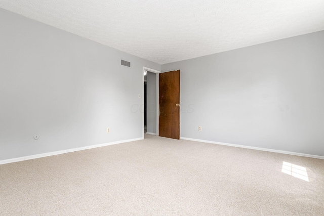 6541 Skywae Dr, Columbus, OH 43229 - spare room featuring light carpet, baseboards, and a textured ceiling