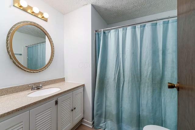 6541 Skywae Dr, Columbus, OH 43229 - bathroom with vanity, a textured ceiling, and toilet