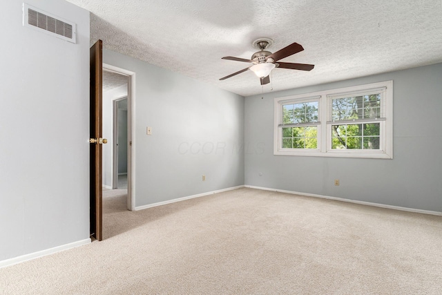 6541 Skywae Dr, Columbus, OH 43229 - spare room with carpet floors, a textured ceiling, a ceiling fan, and baseboards