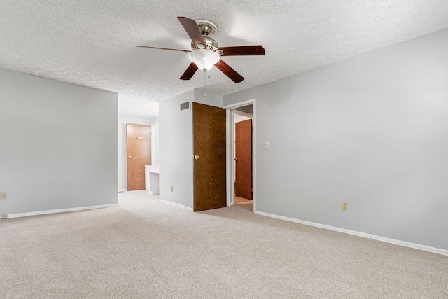 6541 Skywae Dr, Columbus, OH 43229 - spare room featuring ceiling fan, light carpet, a textured ceiling, and baseboards