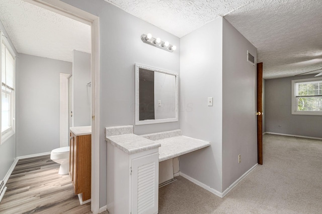 6541 Skywae Dr, Columbus, OH 43229 - bathroom with toilet, a textured ceiling, baseboards, and vanity