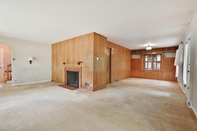 4399 Colerain Ave, Columbus, OH 43214 - unfurnished living room with wood walls, a fireplace, light carpet, and baseboards