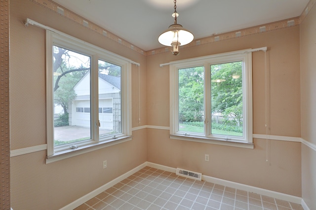 4399 Colerain Ave, Columbus, OH 43214 - unfurnished room with plenty of natural light and baseboards