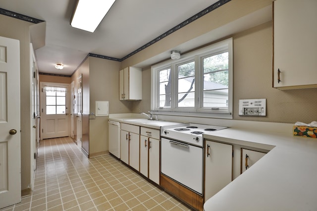 4399 Colerain Ave, Columbus, OH 43214 - kitchen with light countertops, white appliances, a sink, crown molding, and baseboards