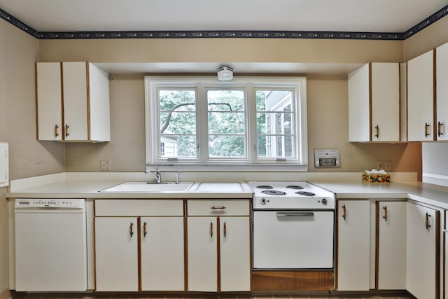4399 Colerain Ave, Columbus, OH 43214 - kitchen with white appliances, a sink, light countertops, and white cabinetry