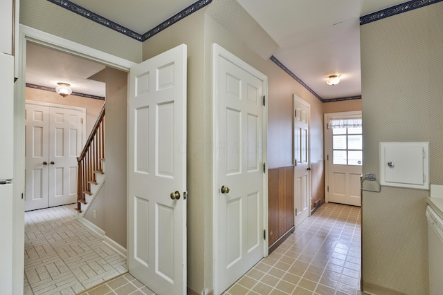 4399 Colerain Ave, Columbus, OH 43214 - hallway featuring baseboards, crown molding, stairs, and brick patterned flooring