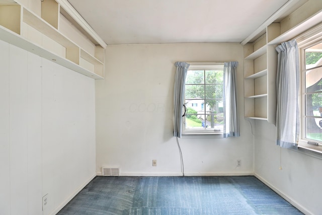 4399 Colerain Ave, Columbus, OH 43214 - carpeted empty room featuring healthy amount of natural light and baseboards