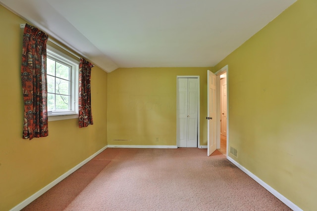 4399 Colerain Ave, Columbus, OH 43214 - empty room featuring baseboards, carpet, and lofted ceiling