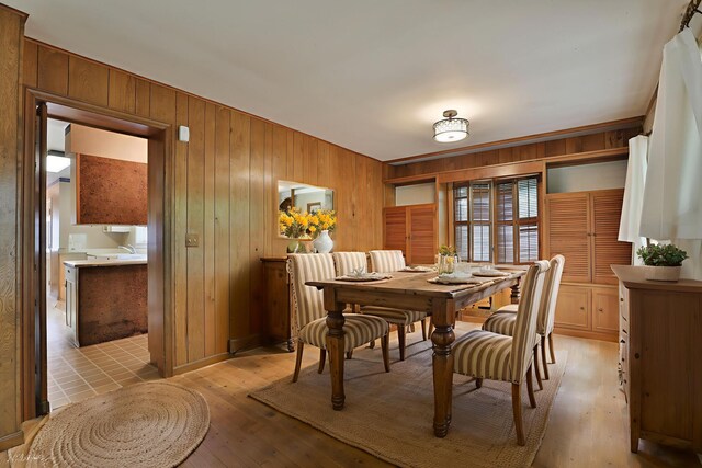 4399 Colerain Ave, Columbus, OH 43214 - dining room with wood walls and light wood-type flooring