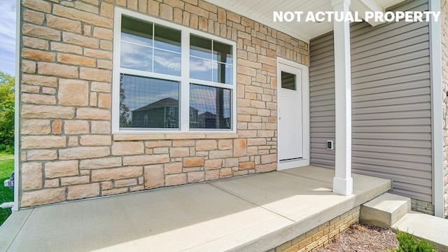 1486 Chrisman Dr, Columbus, OH 43223 - view of exterior entry featuring covered porch and stone siding