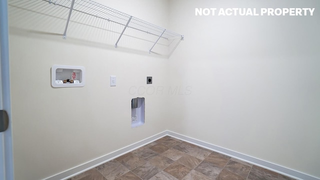 1486 Chrisman Dr, Columbus, OH 43223 - washroom with hookup for an electric dryer, baseboards, washer hookup, and stone finish flooring