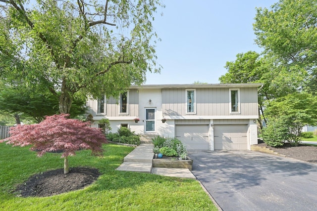 4561 Valley Quail Blvd N, Westerville, OH 43081 - split foyer home with an attached garage, asphalt driveway, and a front lawn