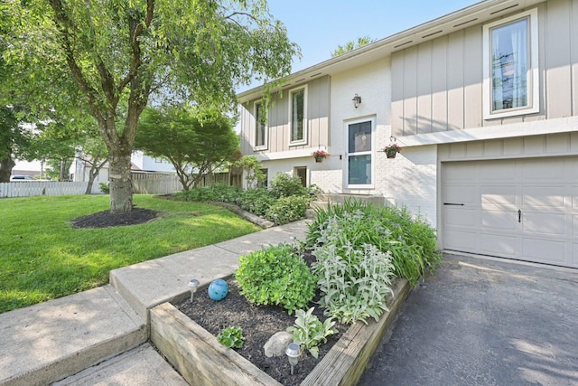 4561 Valley Quail Blvd N, Westerville, OH 43081 - split foyer home featuring a garage, brick siding, and asphalt driveway