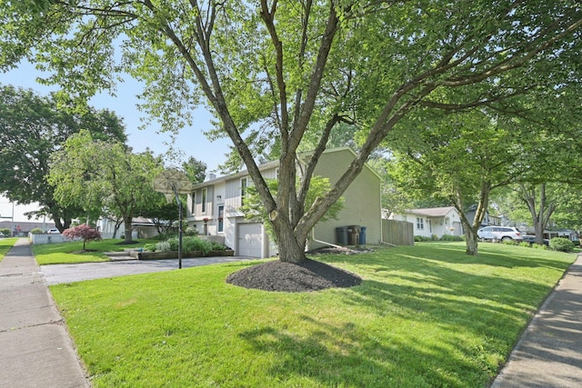 4561 Valley Quail Blvd N, Westerville, OH 43081 - view of front of property featuring driveway, an attached garage, a front lawn, a residential view, and stucco siding