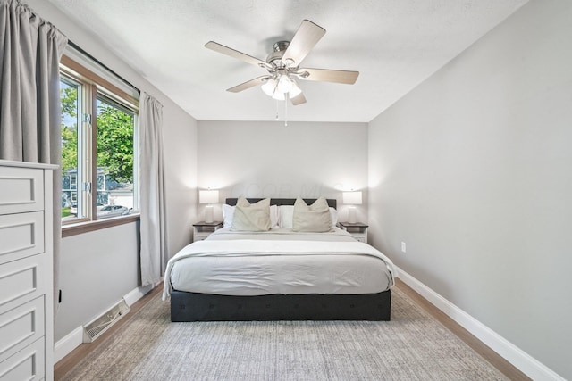 4561 Valley Quail Blvd N, Westerville, OH 43081 - bedroom featuring baseboards, wood finished floors, and a ceiling fan