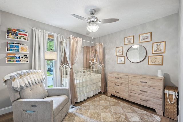 4561 Valley Quail Blvd N, Westerville, OH 43081 - bedroom with wood finished floors, a ceiling fan, and baseboards