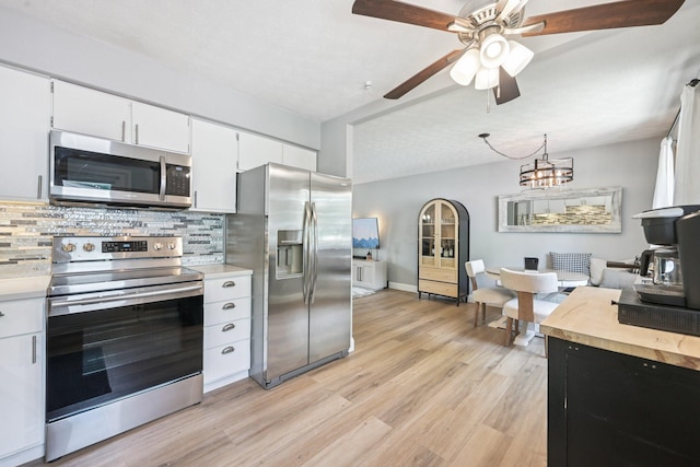 4561 Valley Quail Blvd N, Westerville, OH 43081 - kitchen featuring stainless steel appliances, light countertops, backsplash, and light wood finished floors