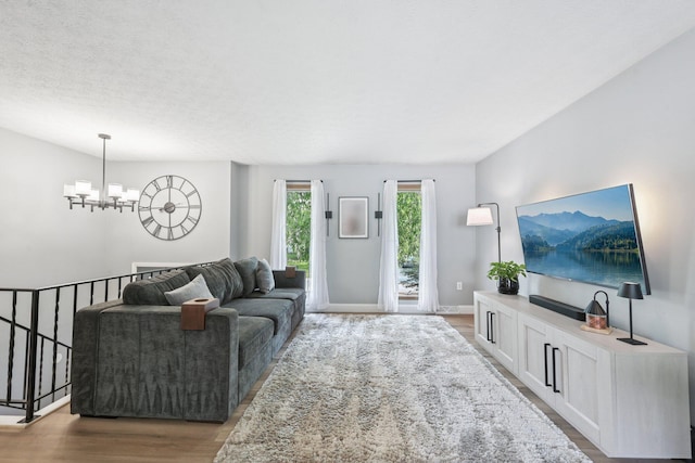 4561 Valley Quail Blvd N, Westerville, OH 43081 - living area featuring a chandelier, wood finished floors, and baseboards