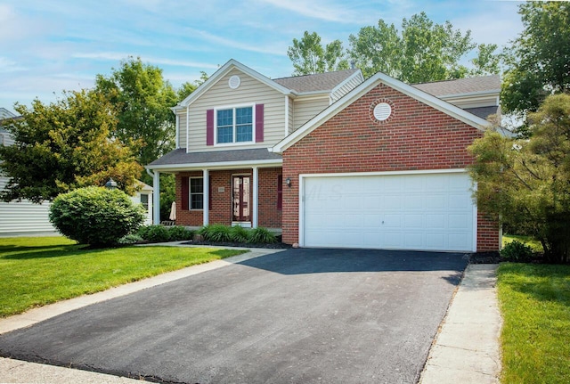 1808 Primrose Ave, Lewis Center, OH 43035 - traditional-style home with brick siding, driveway, a front yard, a garage, and a shingled roof