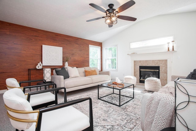 1808 Primrose Ave, Lewis Center, OH 43035 - living area featuring lofted ceiling, wooden walls, ceiling fan, a fireplace, and baseboards