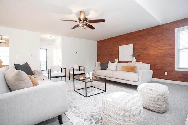 1808 Primrose Ave, Lewis Center, OH 43035 - living room featuring wood walls, ceiling fan, baseboards, a chandelier, and carpet floors