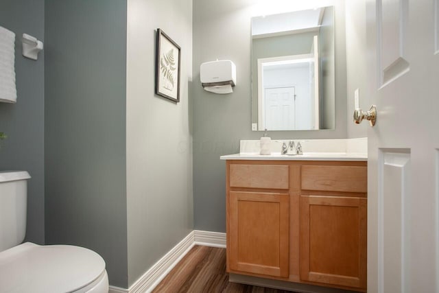 1808 Primrose Ave, Lewis Center, OH 43035 - bathroom featuring toilet, baseboards, vanity, and wood finished floors