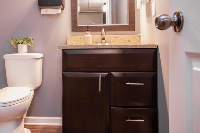 1808 Primrose Ave, Lewis Center, OH 43035 - bathroom with toilet, baseboards, vanity, and wood finished floors