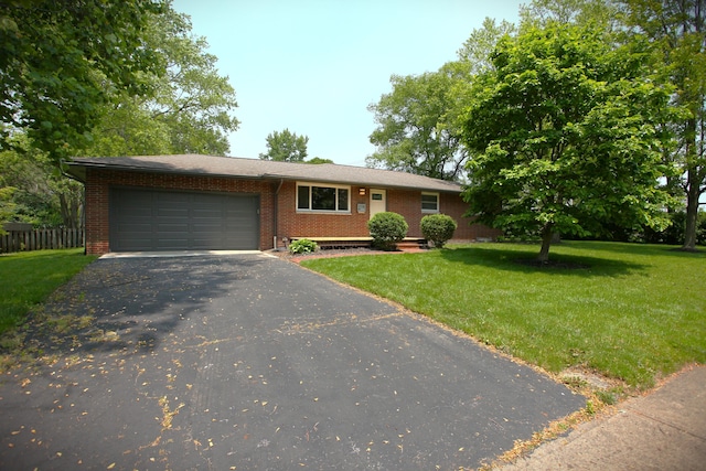1134 Garden Rd, Columbus, OH 43224 - view of front of property with an attached garage, driveway, and brick siding