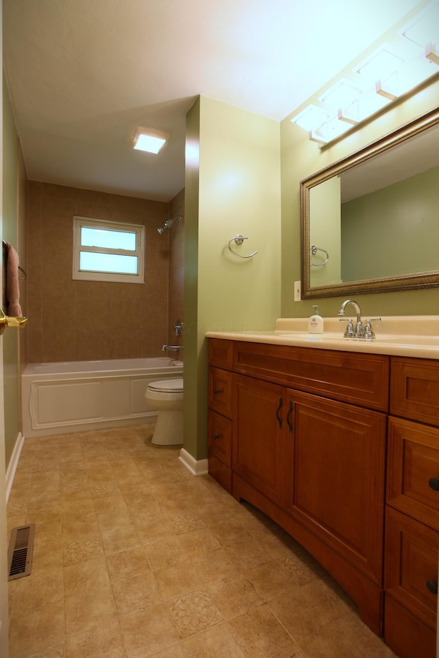 1134 Garden Rd, Columbus, OH 43224 - bathroom featuring toilet, vanity, and  shower combination