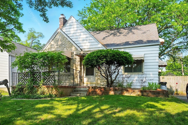 443 Binns Blvd, Columbus, OH 43204 - view of front of house featuring a chimney, stone siding, and a shingled roof