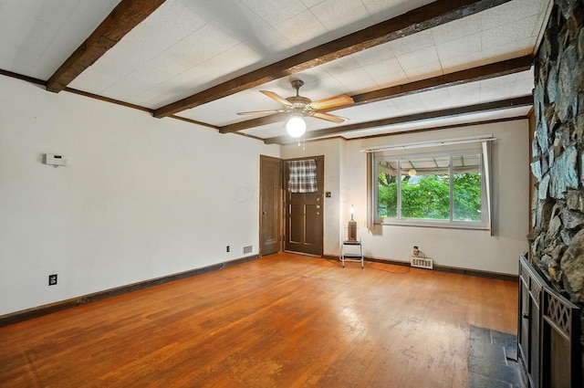 443 Binns Blvd, Columbus, OH 43204 - unfurnished living room featuring wood finished floors, baseboards, beamed ceiling, and a ceiling fan