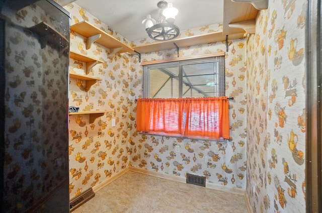 443 Binns Blvd, Columbus, OH 43204 - bathroom featuring baseboards, a chandelier, and wallpapered walls