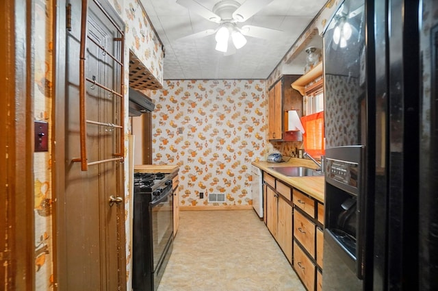 443 Binns Blvd, Columbus, OH 43204 - kitchen with a sink, wallpapered walls, black appliances, extractor fan, and ceiling fan