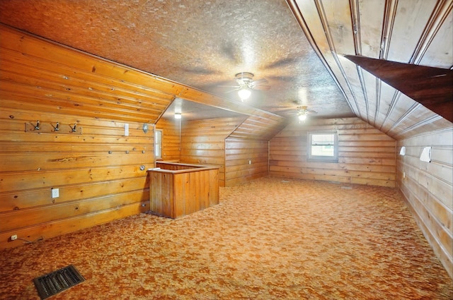 443 Binns Blvd, Columbus, OH 43204 - additional living space featuring a ceiling fan, carpet floors, wooden walls, and lofted ceiling